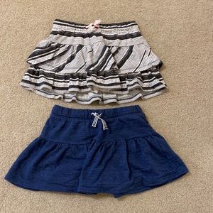 A bundle of 2 Cat and Jack Skorts size 6/6X. Both in EUC